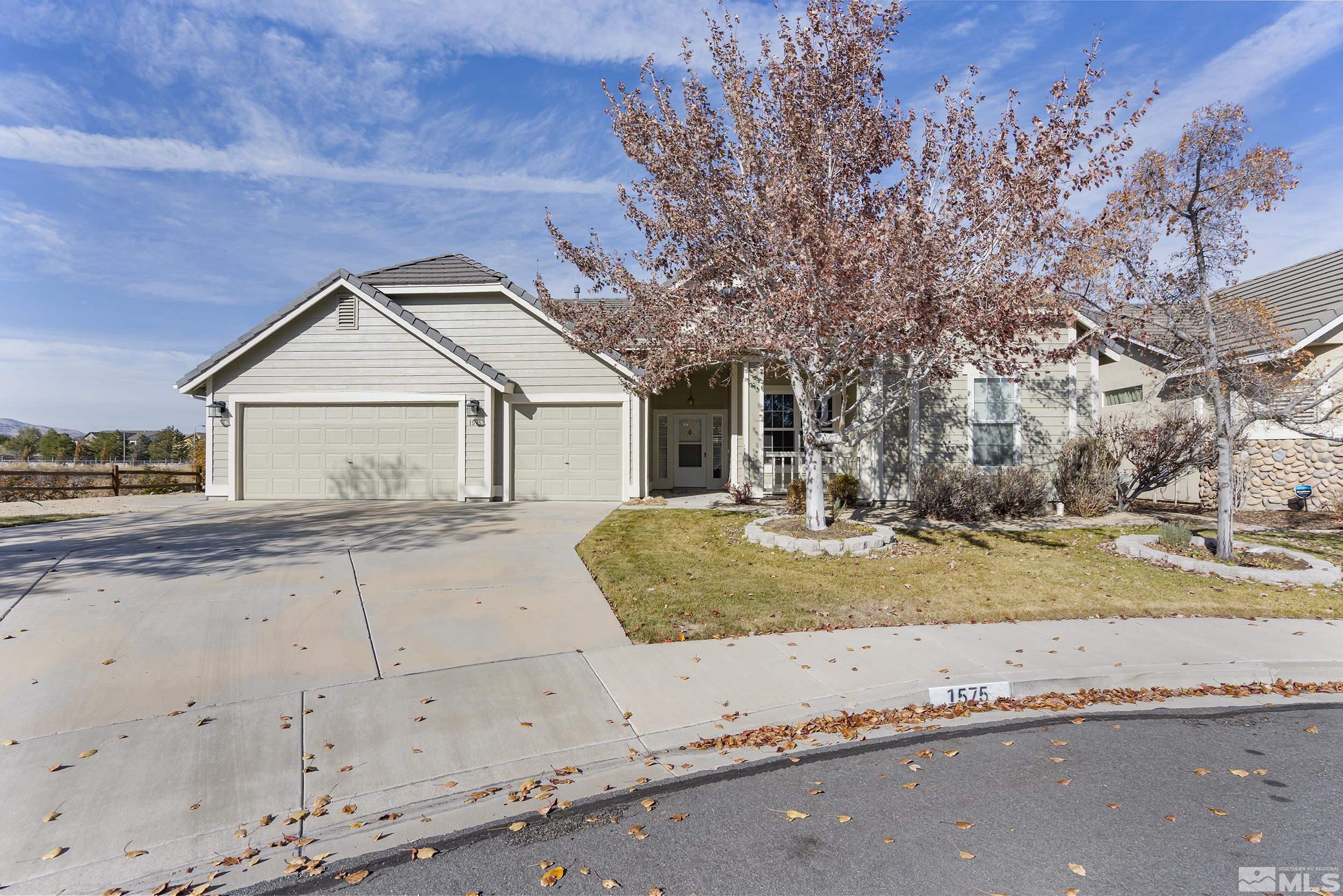 1575 Wyatt Court Reno, NV 89521 - Photo 1 of 40 a front view of a house with a yard