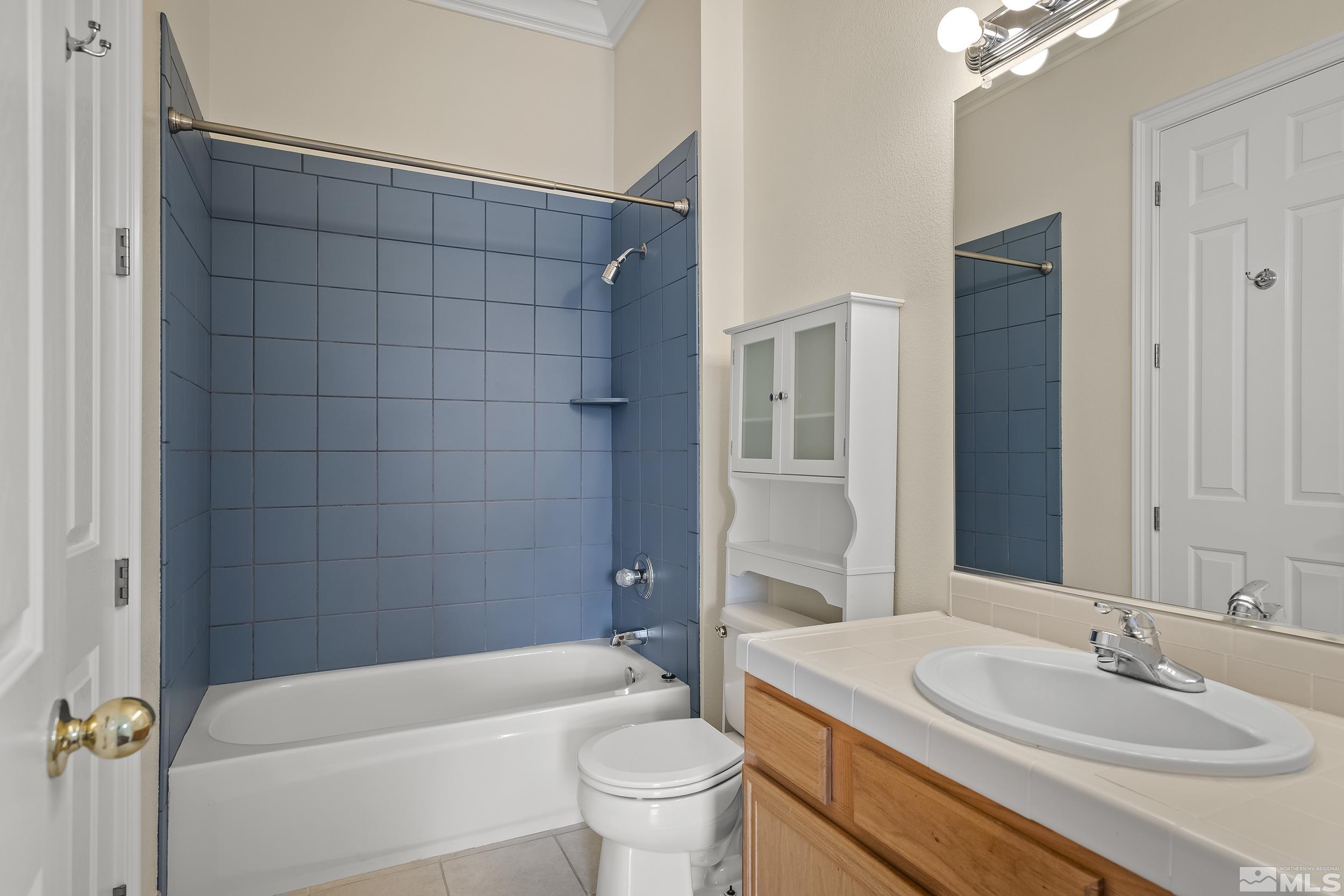 1575 Wyatt Court Reno, NV 89521 - Photo 21 of 40 a bathroom with a sink a toilet and shower