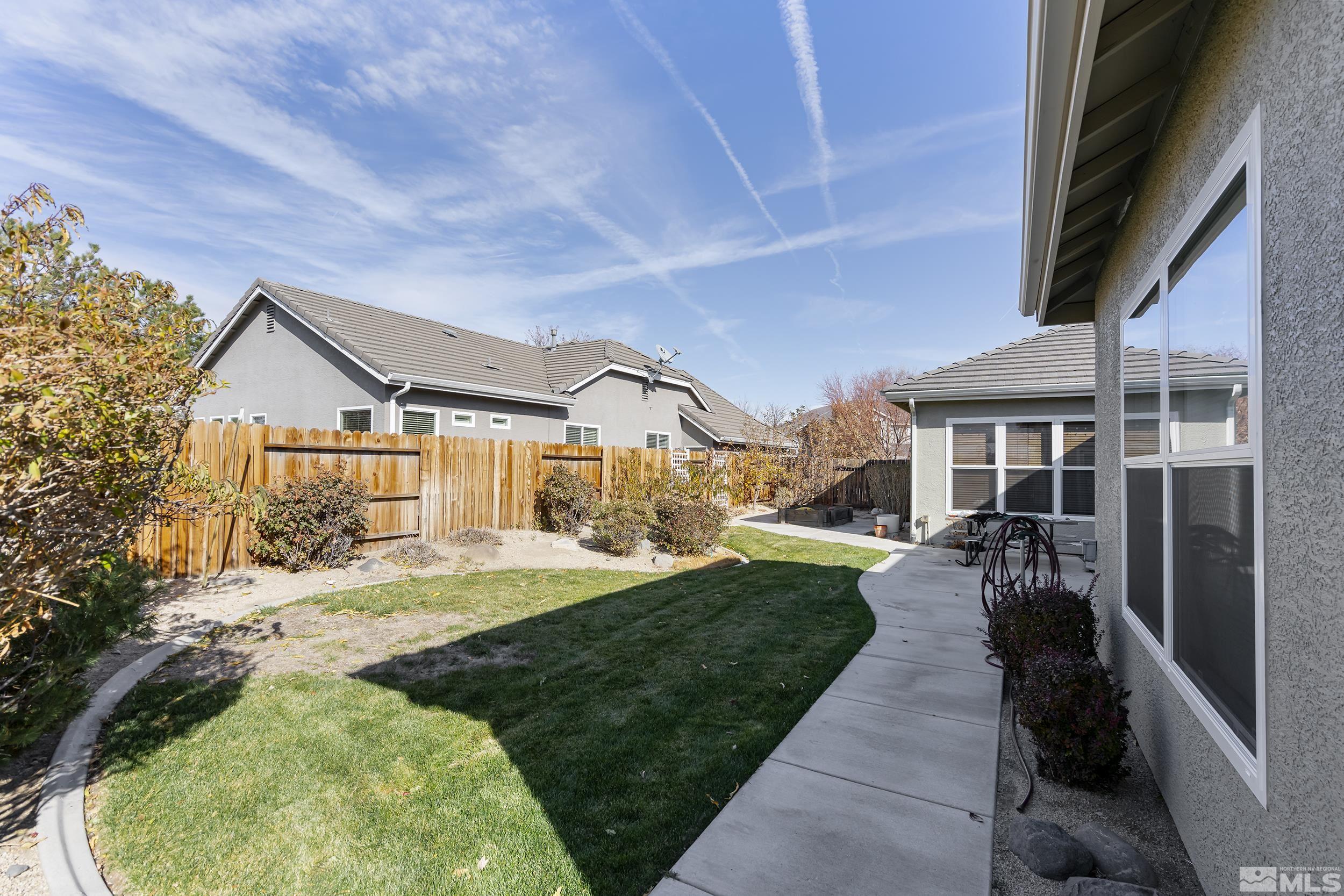 1575 Wyatt Court Reno, NV 89521 - Photo 25 of 40 front view of a house with a yard