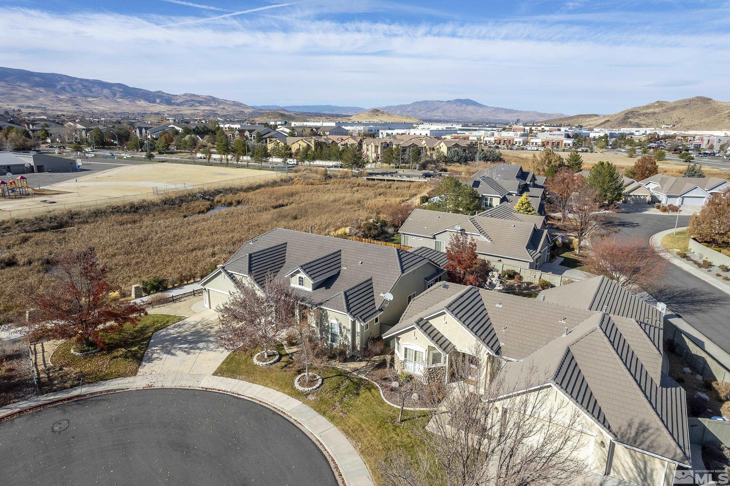 1575 Wyatt Court Reno, NV 89521 - Photo 32 of 40 an aerial view of a city with ocean view
