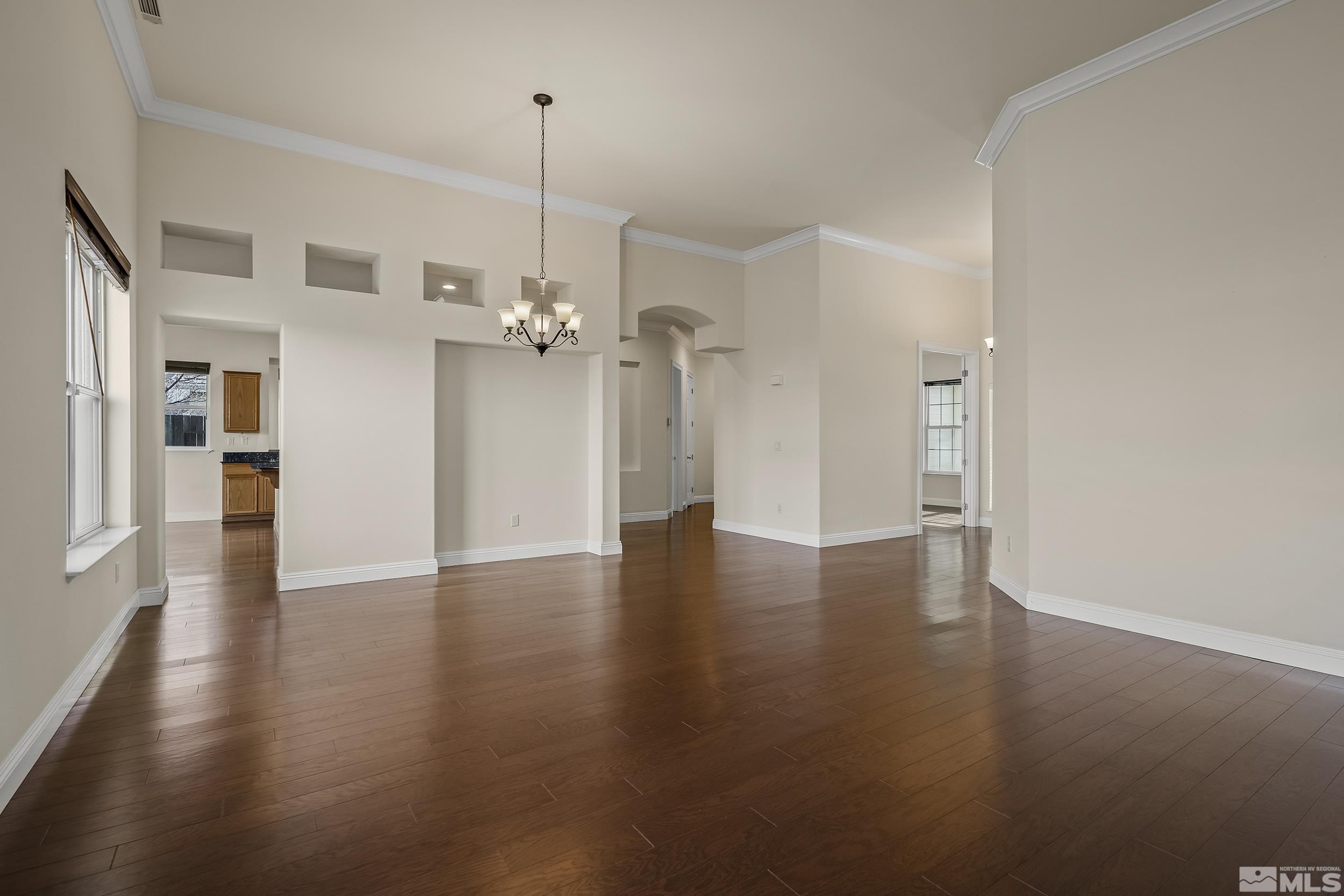1575 Wyatt Court Reno, NV 89521 - Photo 5 of 40 a view of a room with wooden floor and a ceiling fan