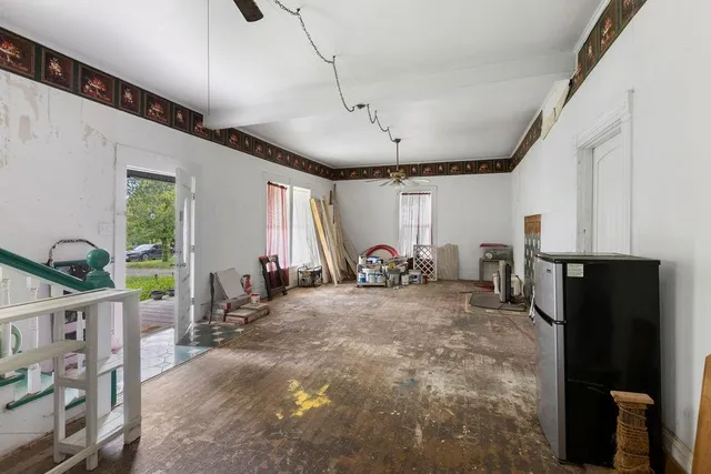 a bathroom with a toilet and shower curtain
