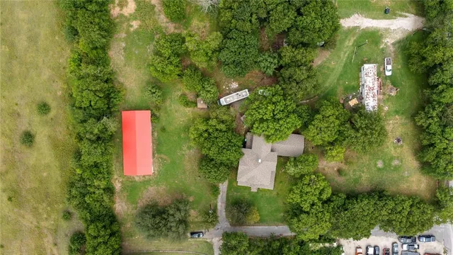 a close up of a house with a yard and garden