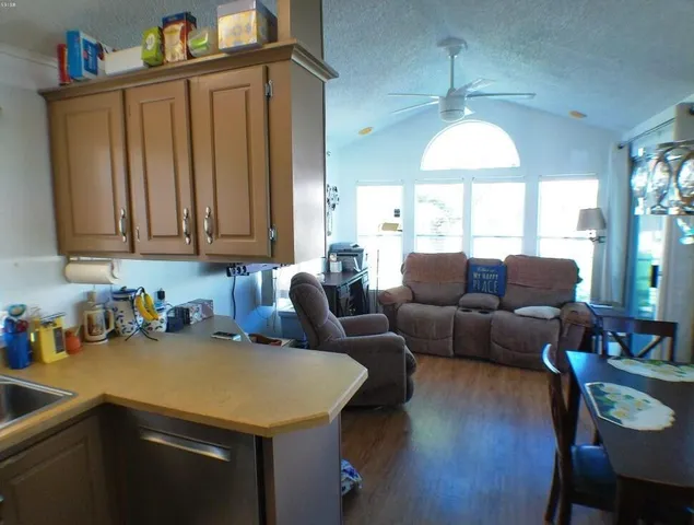 a bathroom with a tub shower vanity and sink