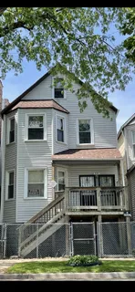 a front view of a house with a boat