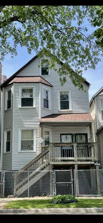 a front view of a house with a boat