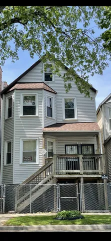 a front view of a house with a boat