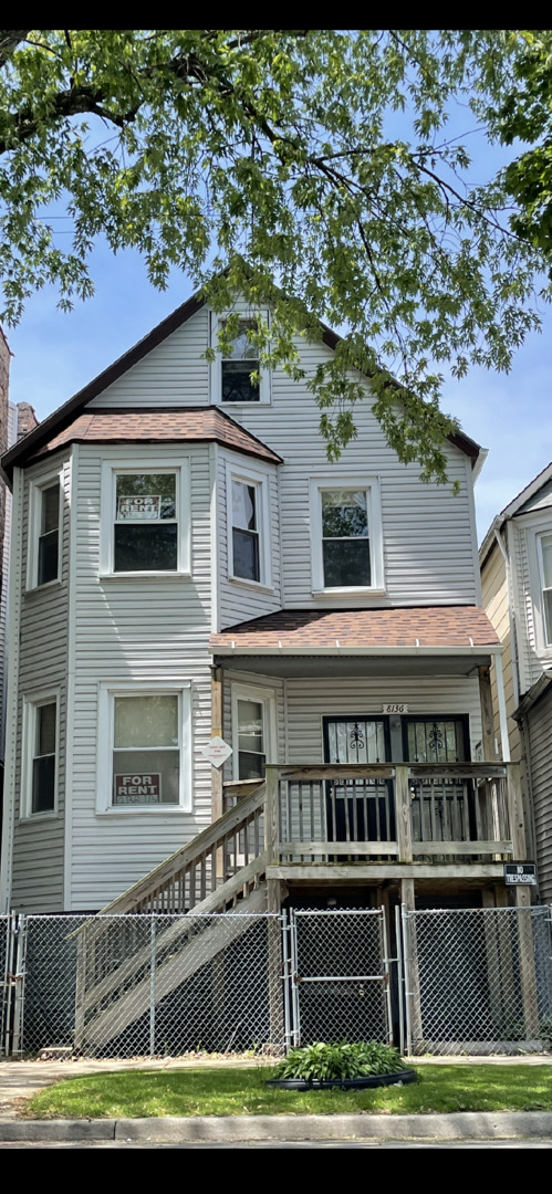 8136 South Exchange Avenue, Unit 2 Chicago, IL 60617 - Photo 1 of 1 a front view of a house with a boat