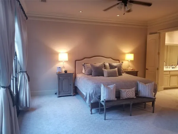 a bedroom with a bed and a couch