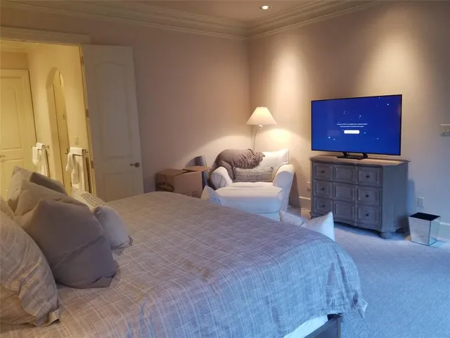 a bedroom with a bed and a fireplace