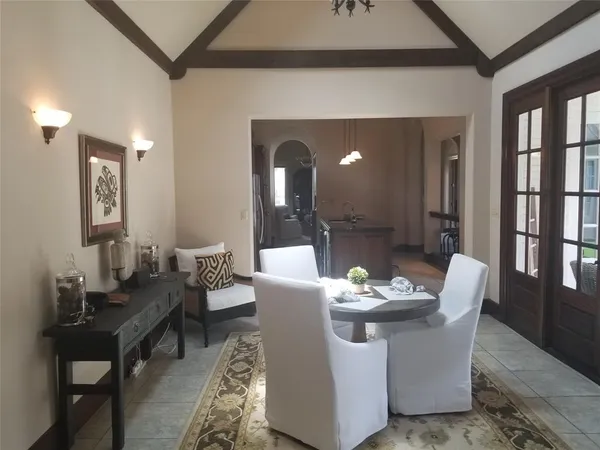 a dining room with furniture and window