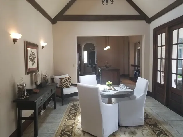 a dining room with furniture and window