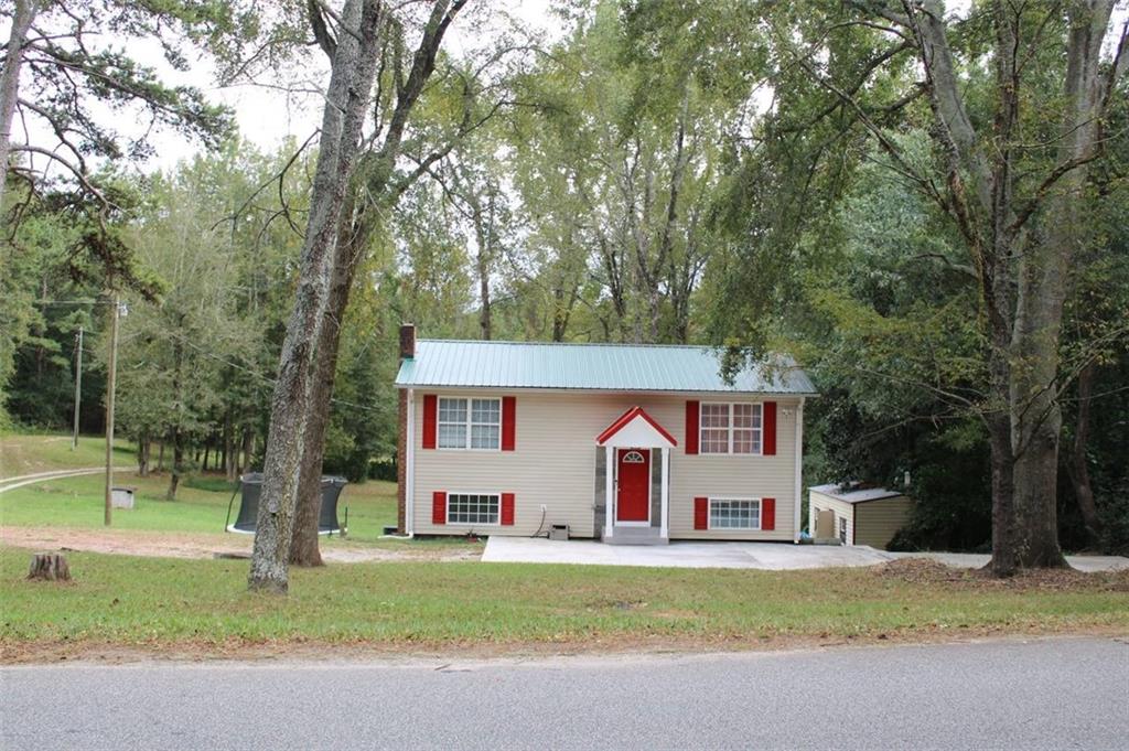1174 Academy Church Road Jefferson, GA 30549 - Photo 1 of 1 a front view of house with yard and trees