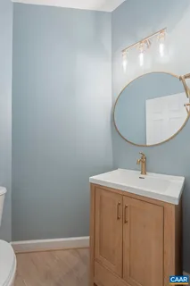 a front view of a house with plants