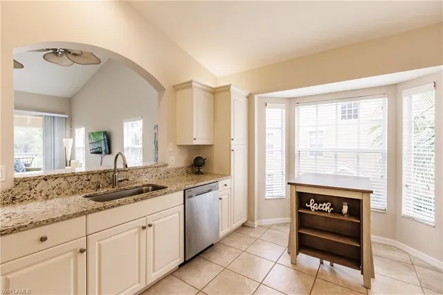 a spacious bathroom with a sink a mirror and a bathtub