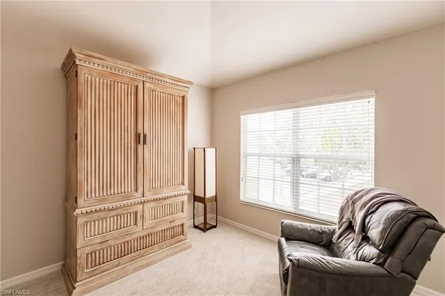 a view of a livingroom with furniture wooden floor and windows