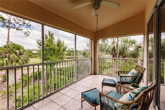 a view of a city from a dining room with a floor to ceiling window