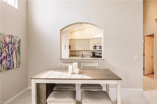 a room with a table and chairs