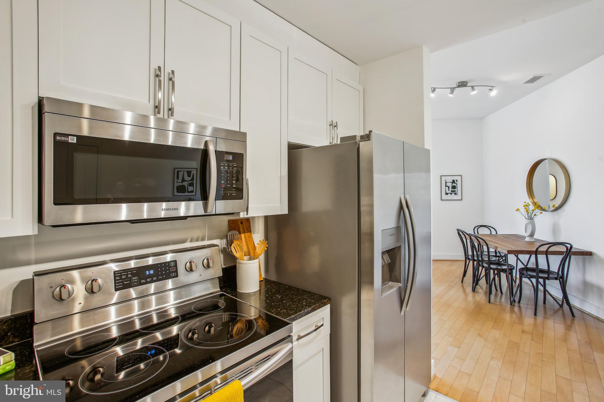 4101 Albemarle Street Northwest, Unit 620 Washington, DC 20016 - Photo 13 of 37 White cabinets