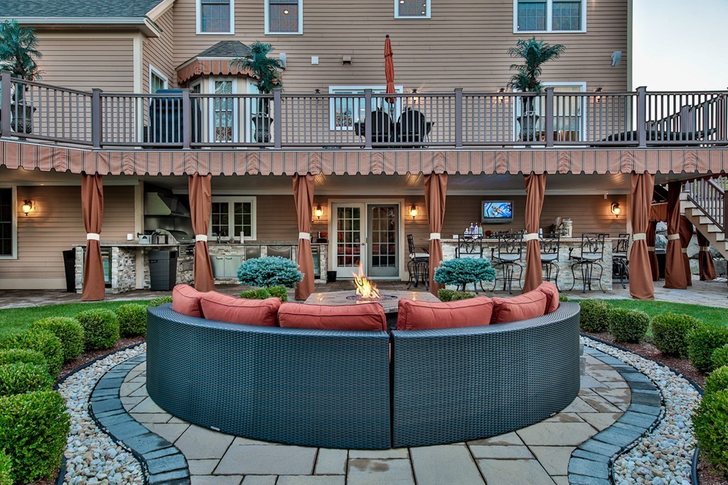 29 Hilltop Avenue Saugus, MA 01906 - Photo 11 of 30 a view of a house with outdoor kitchen outdoor seating