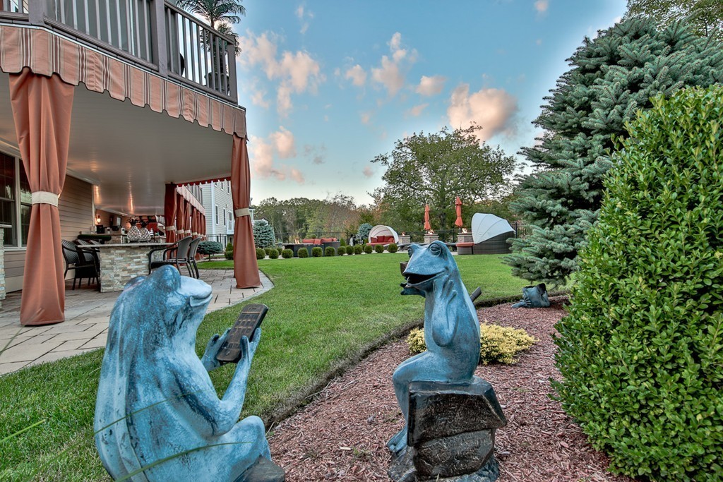 29 Hilltop Avenue Saugus, MA 01906 - Photo 13 of 30 a front view of a garden with fountain