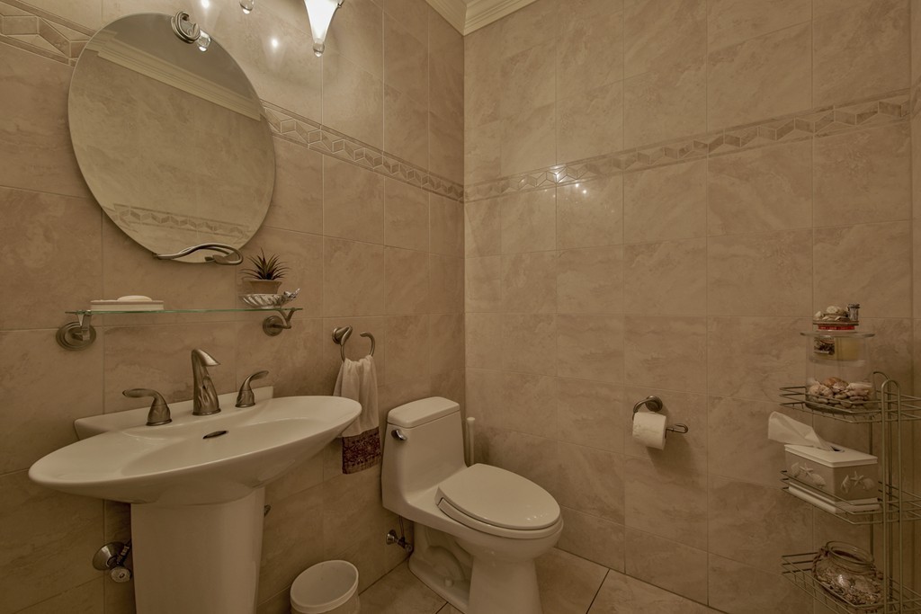 29 Hilltop Avenue Saugus, MA 01906 - Photo 22 of 30 a bathroom with a sink mirror and toilet