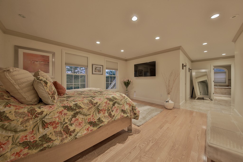 29 Hilltop Avenue Saugus, MA 01906 - Photo 23 of 30 a spacious bedroom with a large bed and a large window