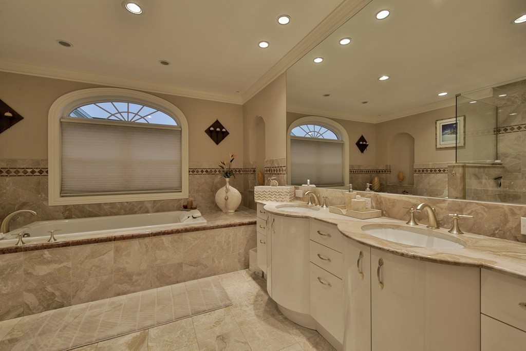 29 Hilltop Avenue Saugus, MA 01906 - Photo 26 of 30 a bathroom with a double vanity sink and a mirror