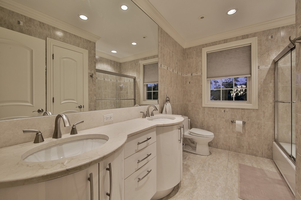 29 Hilltop Avenue Saugus, MA 01906 - Photo 28 of 30 a bathroom with a double vanity sink mirror and toilet