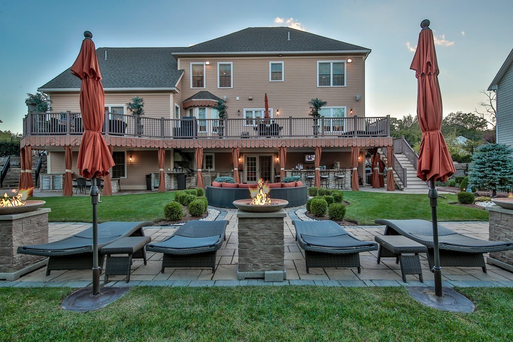 29 Hilltop Avenue Saugus, MA 01906 - Photo 4 of 30 a front view of a house with a garden and sitting area