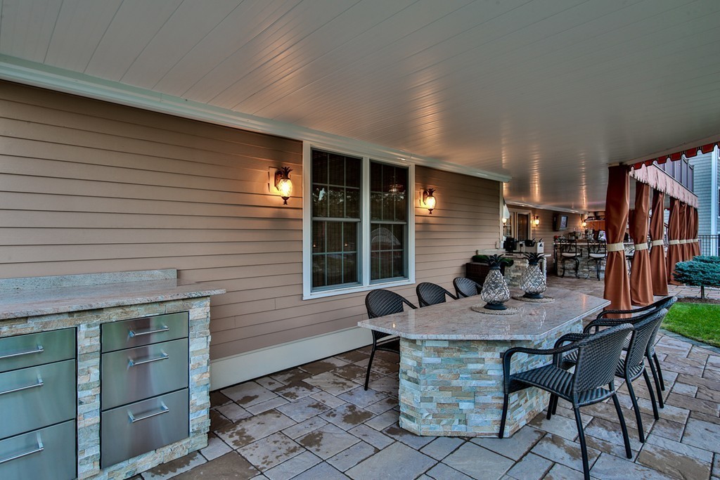 29 Hilltop Avenue Saugus, MA 01906 - Photo 6 of 30 a view of a dinning table and chairs in the patio