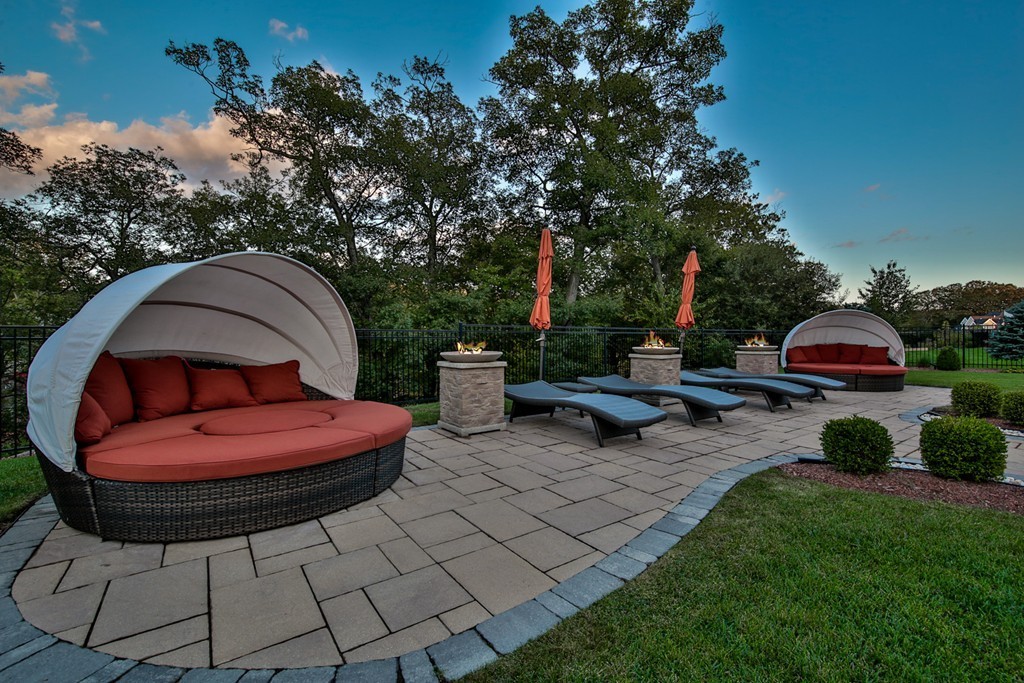 29 Hilltop Avenue Saugus, MA 01906 - Photo 10 of 30 a view of a backyard with table and chairs potted plants and a fountain