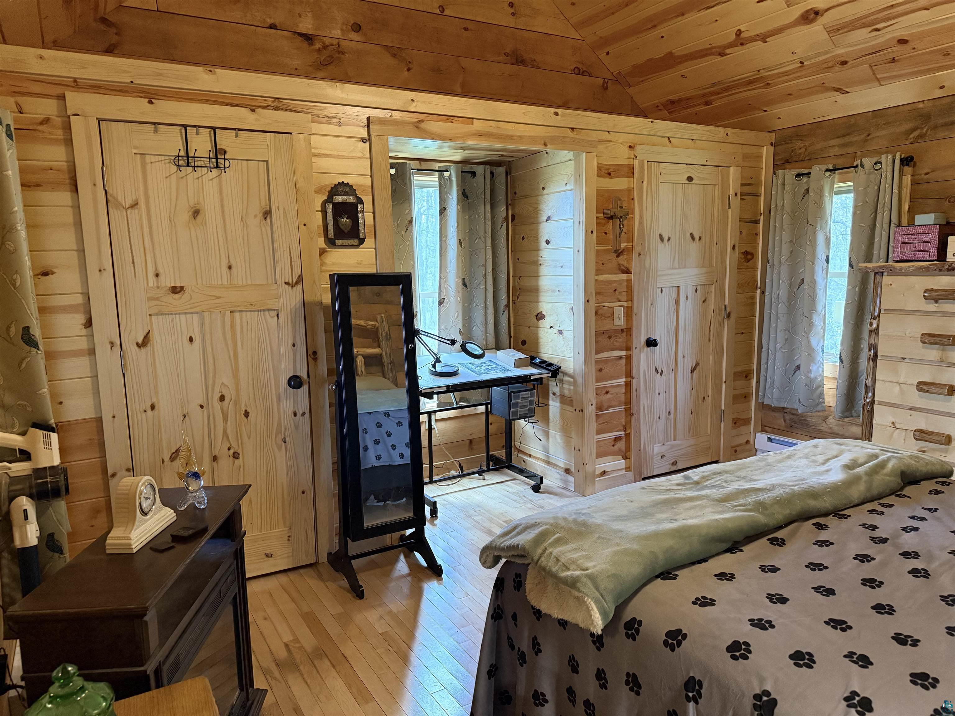 37590 Degerstrom Road Askov, MN 55704 - Photo 18 of 53 Room featuring exposed wood plank walls and a wood plank ceiling