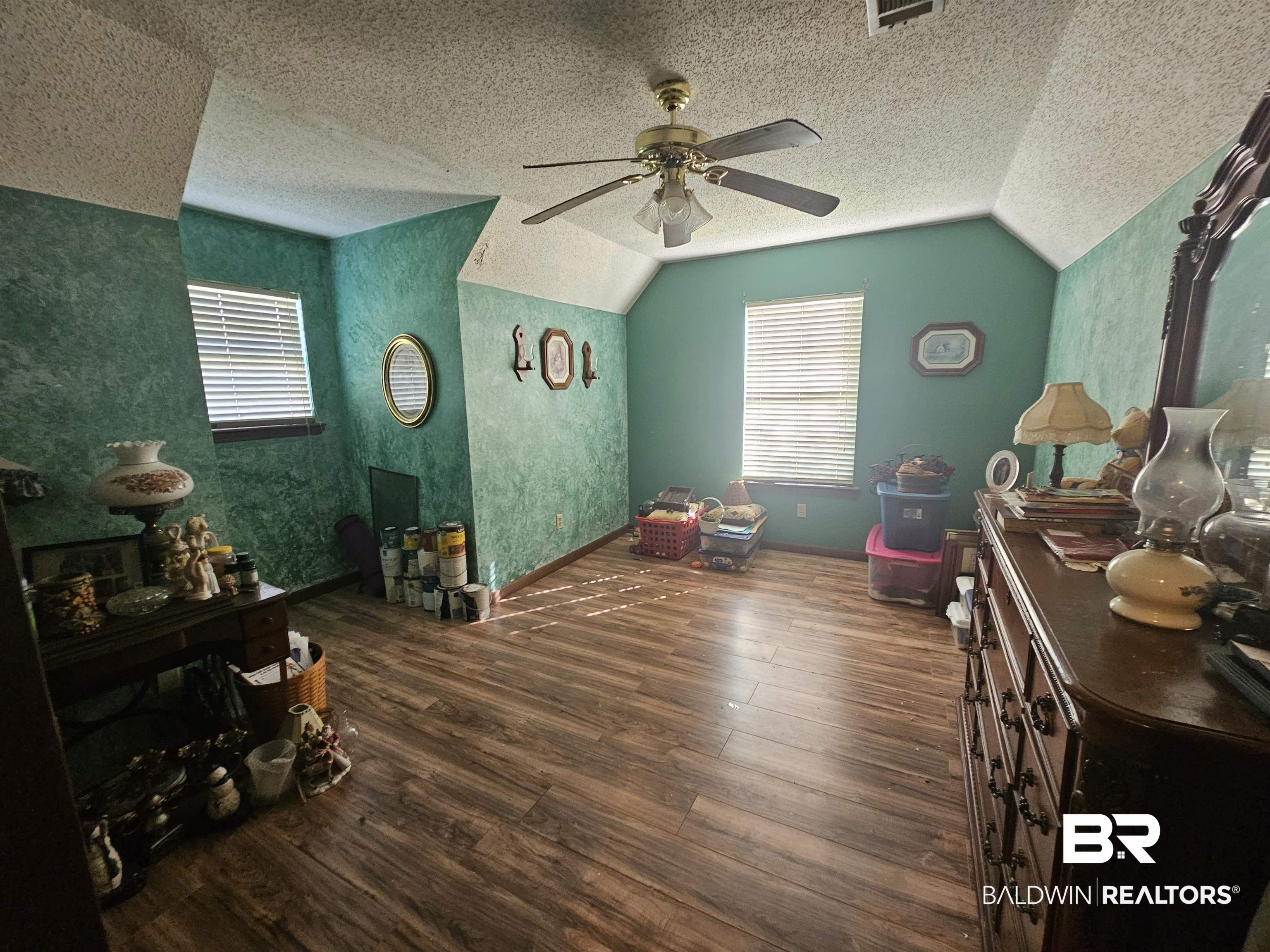 1818 Old Fannie Road Flomaton, AL 36441 - Photo 16 of 20 Additional living space featuring wood finished floors, lofted ceiling, a ceiling fan, a textured ceiling, and plenty of natural light