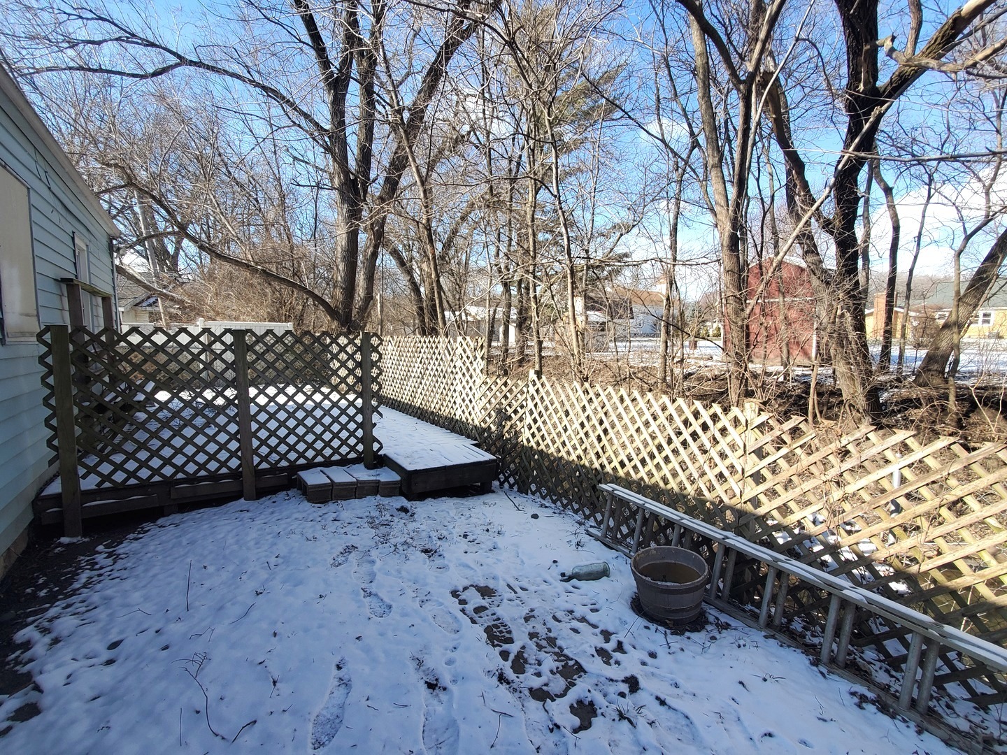 316 1/2 Prairie Street Ottawa, IL 61350 - Photo 3 of 13 a view of a yard with wooden fence