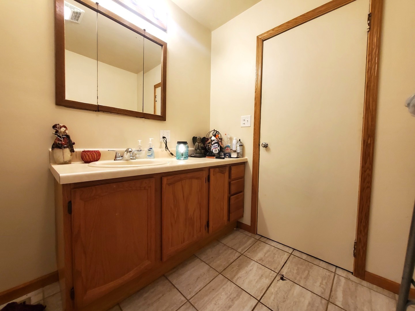 316 1/2 Prairie Street Ottawa, IL 61350 - Photo 8 of 13 a bathroom with a sink and a mirror