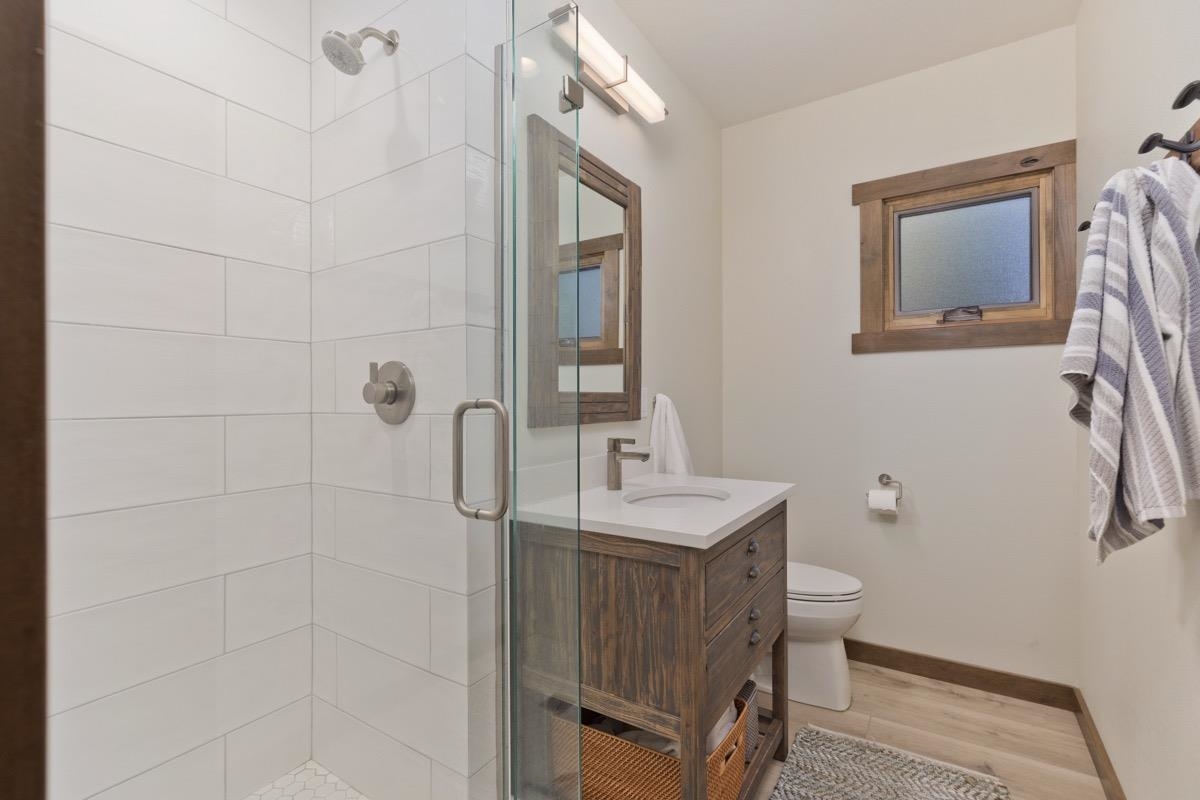 670 John Muir Road, Unit 1 Mammoth Lakes, CA 93546 - Photo 15 of 50 Full bath with a shower stall, vanity, and wood finished floors
