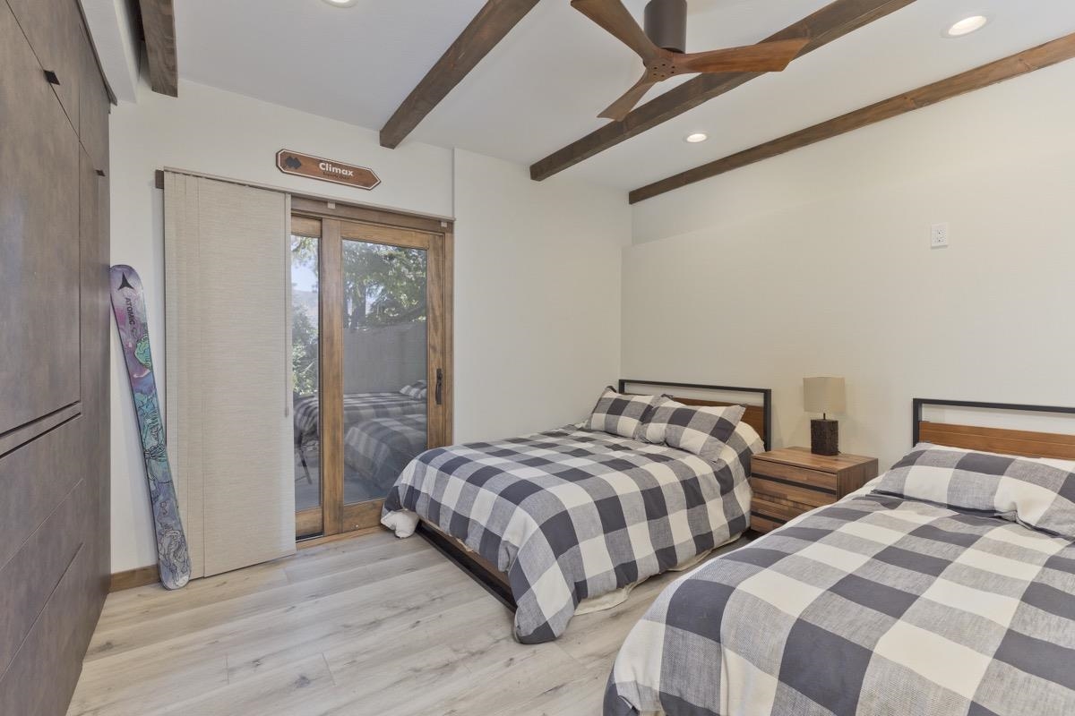 670 John Muir Road, Unit 1 Mammoth Lakes, CA 93546 - Photo 16 of 50 Bedroom featuring beam ceiling, access to outside, recessed lighting, light wood-style flooring, and a ceiling fan