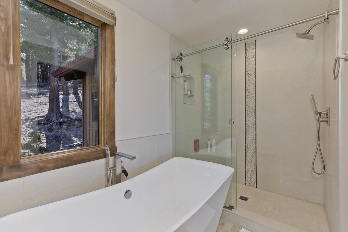670 John Muir Road, Unit 1 Mammoth Lakes, CA 93546 - Photo 25 of 50 Full bath with a stall shower and a freestanding tub