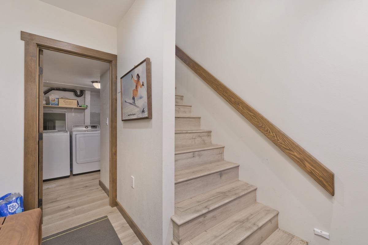 670 John Muir Road, Unit 1 Mammoth Lakes, CA 93546 - Photo 31 of 50 Stairway featuring separate washer and dryer and wood finished floors