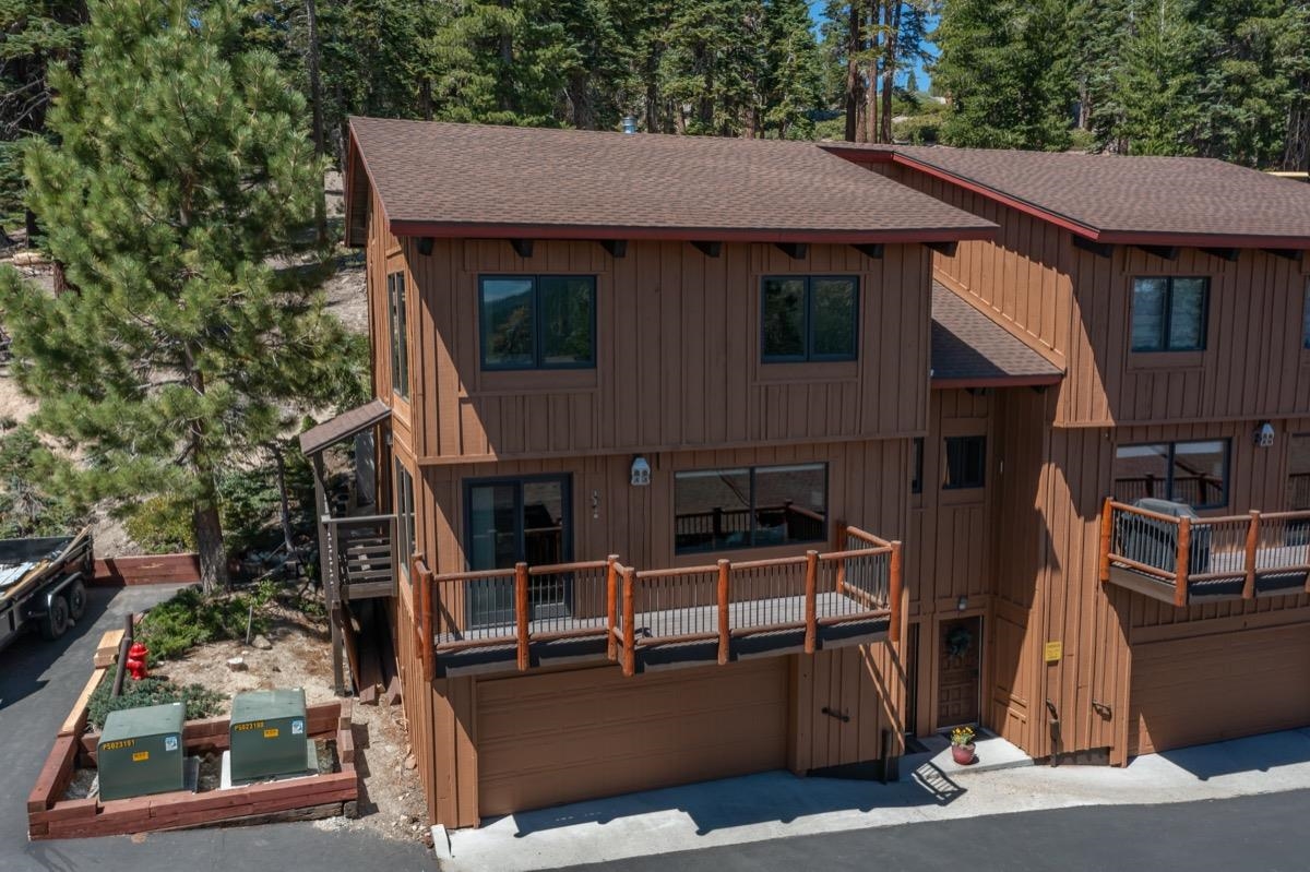 670 John Muir Road, Unit 1 Mammoth Lakes, CA 93546 - Photo 44 of 50 Rustic home featuring roof with shingles, board and batten siding, and a garage