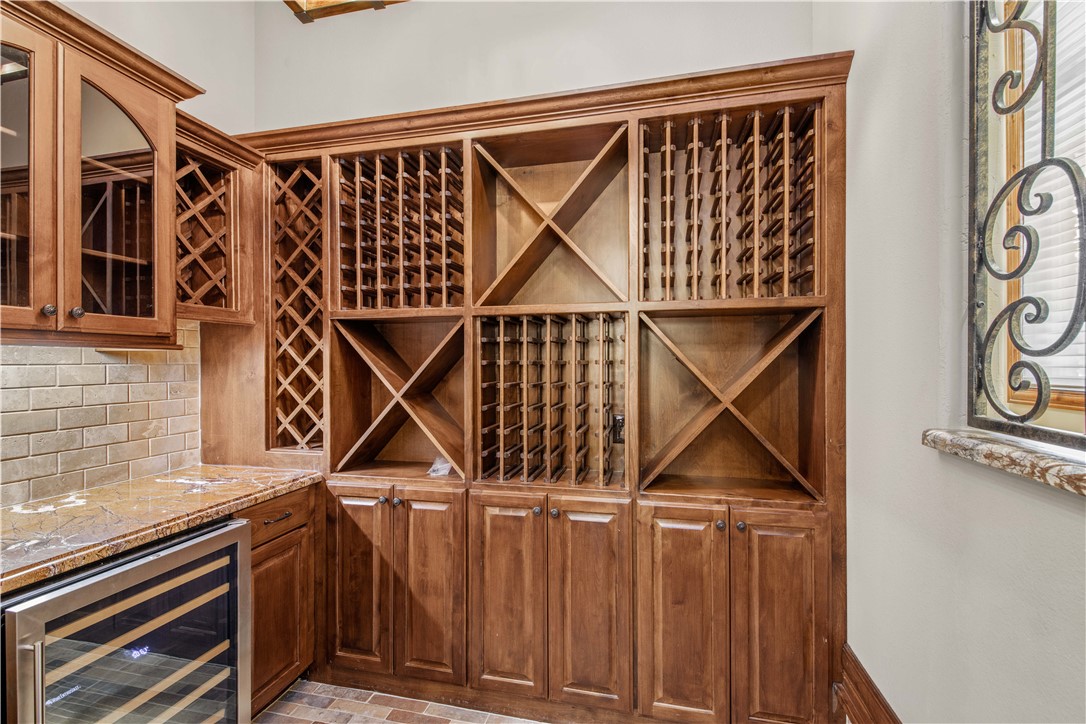 4207 Tuscany Court Bryan, TX 77802 - Photo 23 of 50 Wine area with beverage cooler