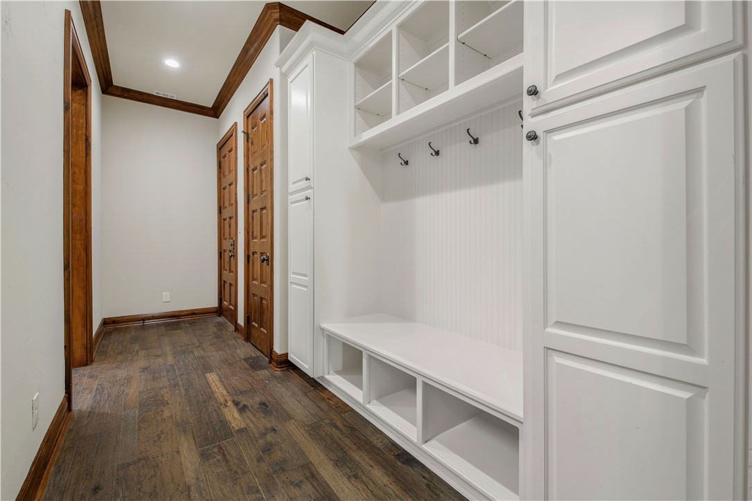 4207 Tuscany Court Bryan, TX 77802 - Photo 27 of 50 Mudroom featuring crown molding, dark wood finished floors, and recessed lighting