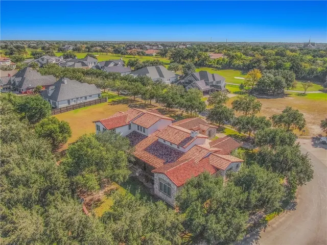 an aerial view of residential house with outdoor space