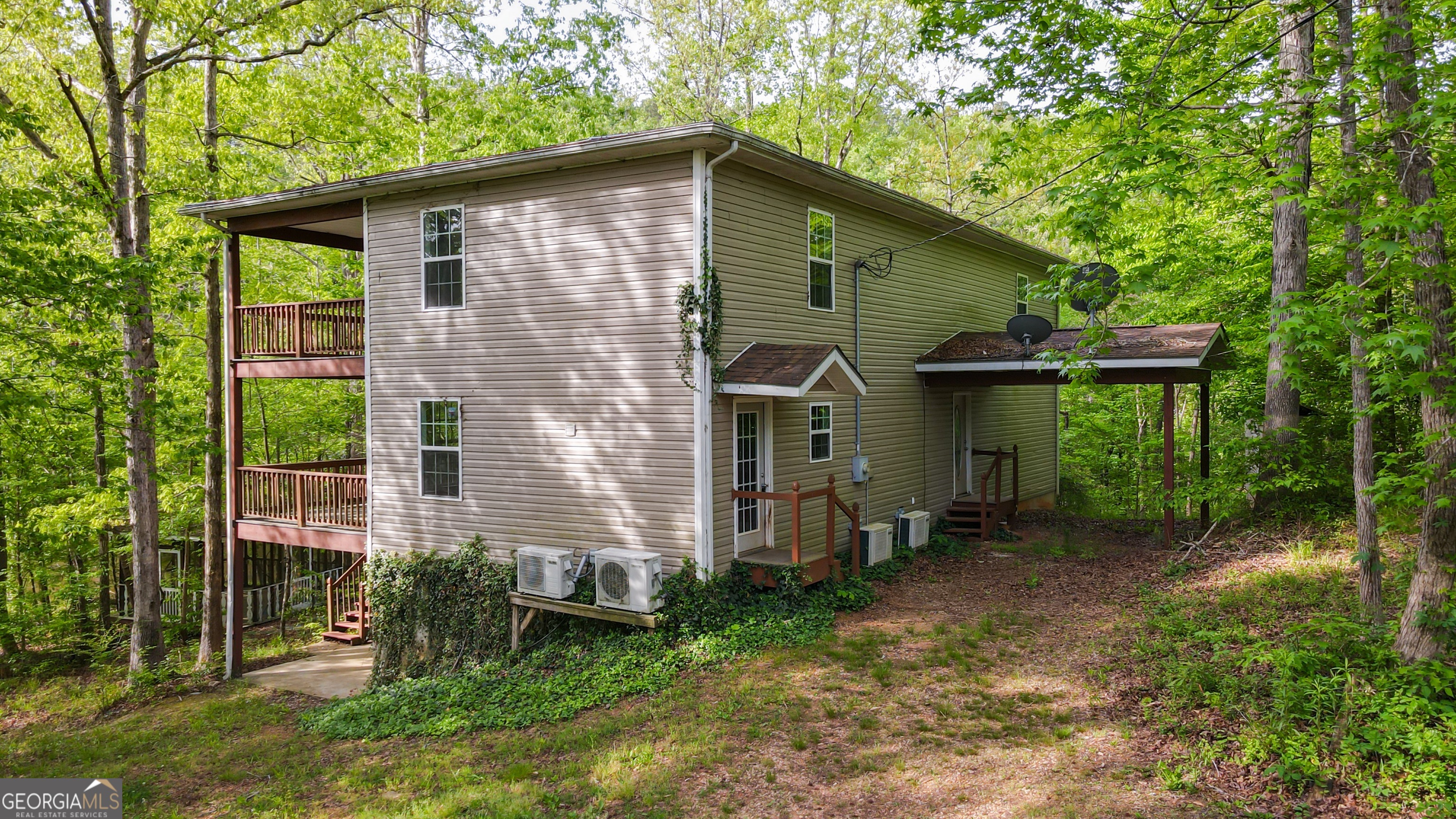 3719 County Road 88 Delta, AL 36258 - Photo 1 of 36 a front view of a house with garden