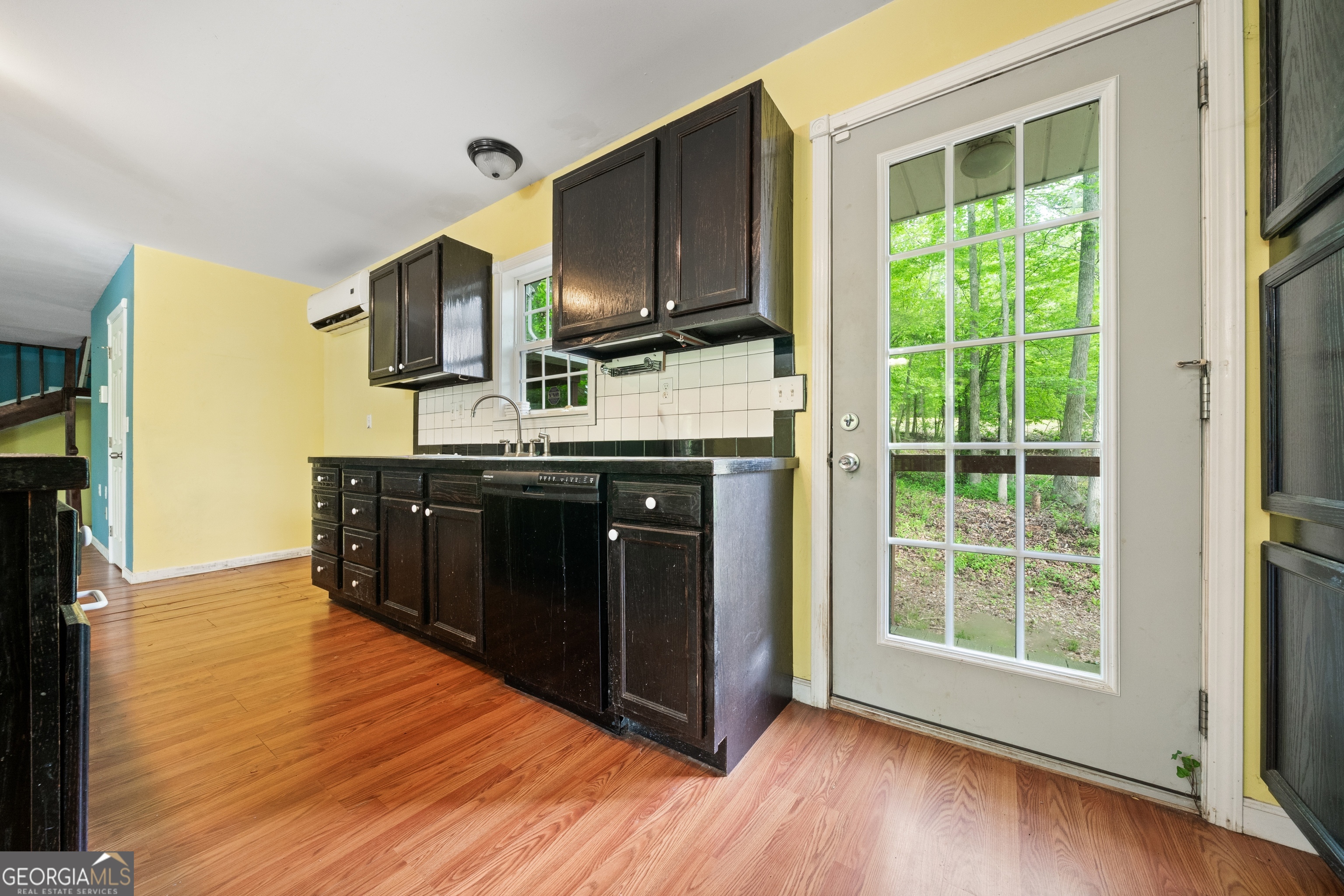 3719 County Road 88 Delta, AL 36258 - Photo 11 of 36 a kitchen with stainless steel appliances granite countertop a stove a sink and a large window