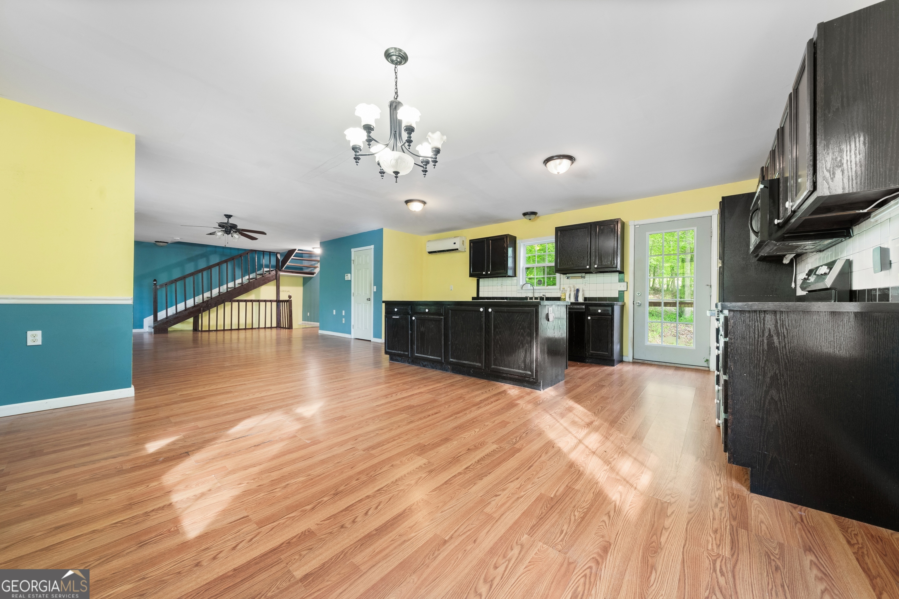 3719 County Road 88 Delta, AL 36258 - Photo 13 of 36 a view of a kitchen with furniture and a ceiling fan