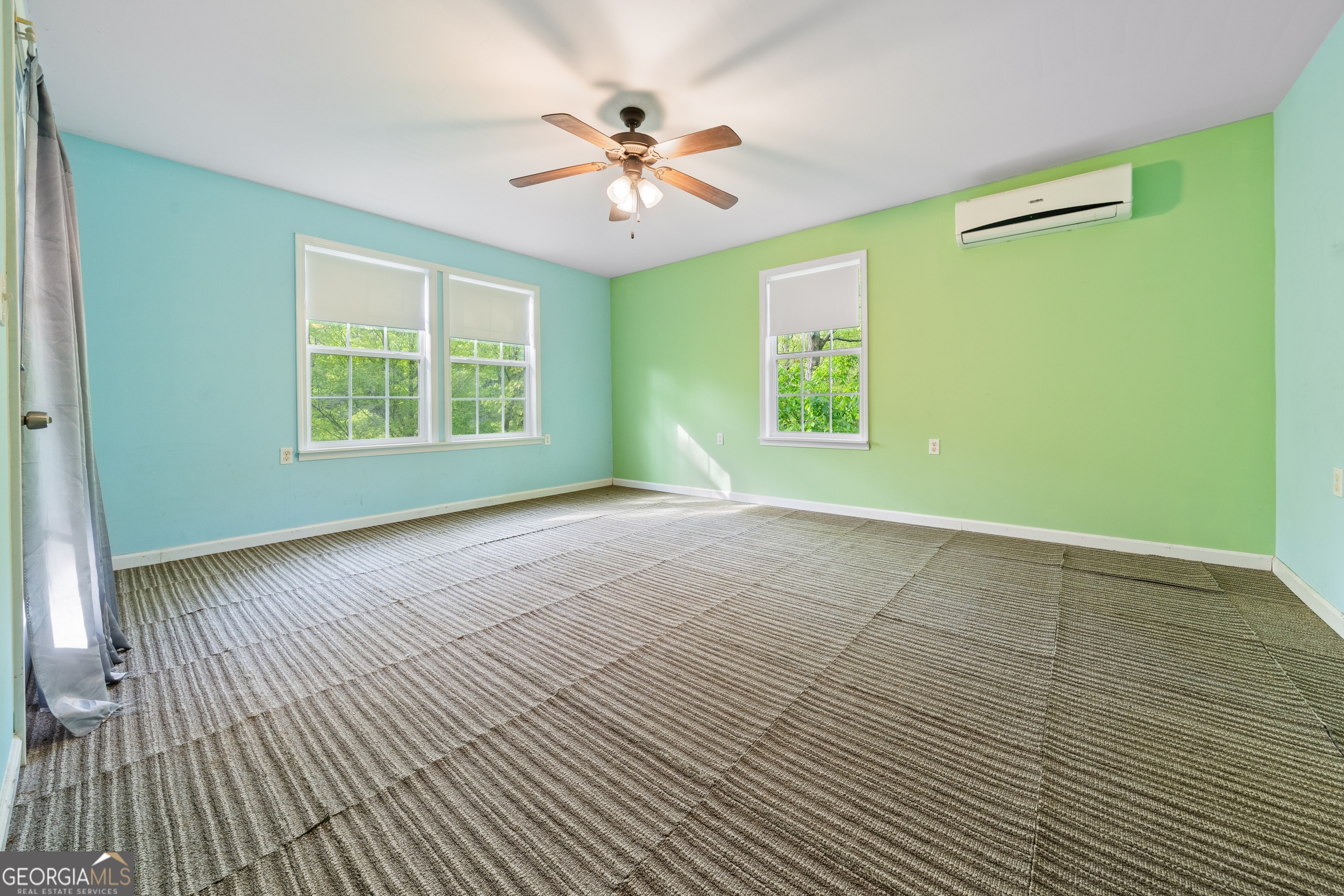 3719 County Road 88 Delta, AL 36258 - Photo 19 of 36 a view of an empty room with a window and a chandelier fan