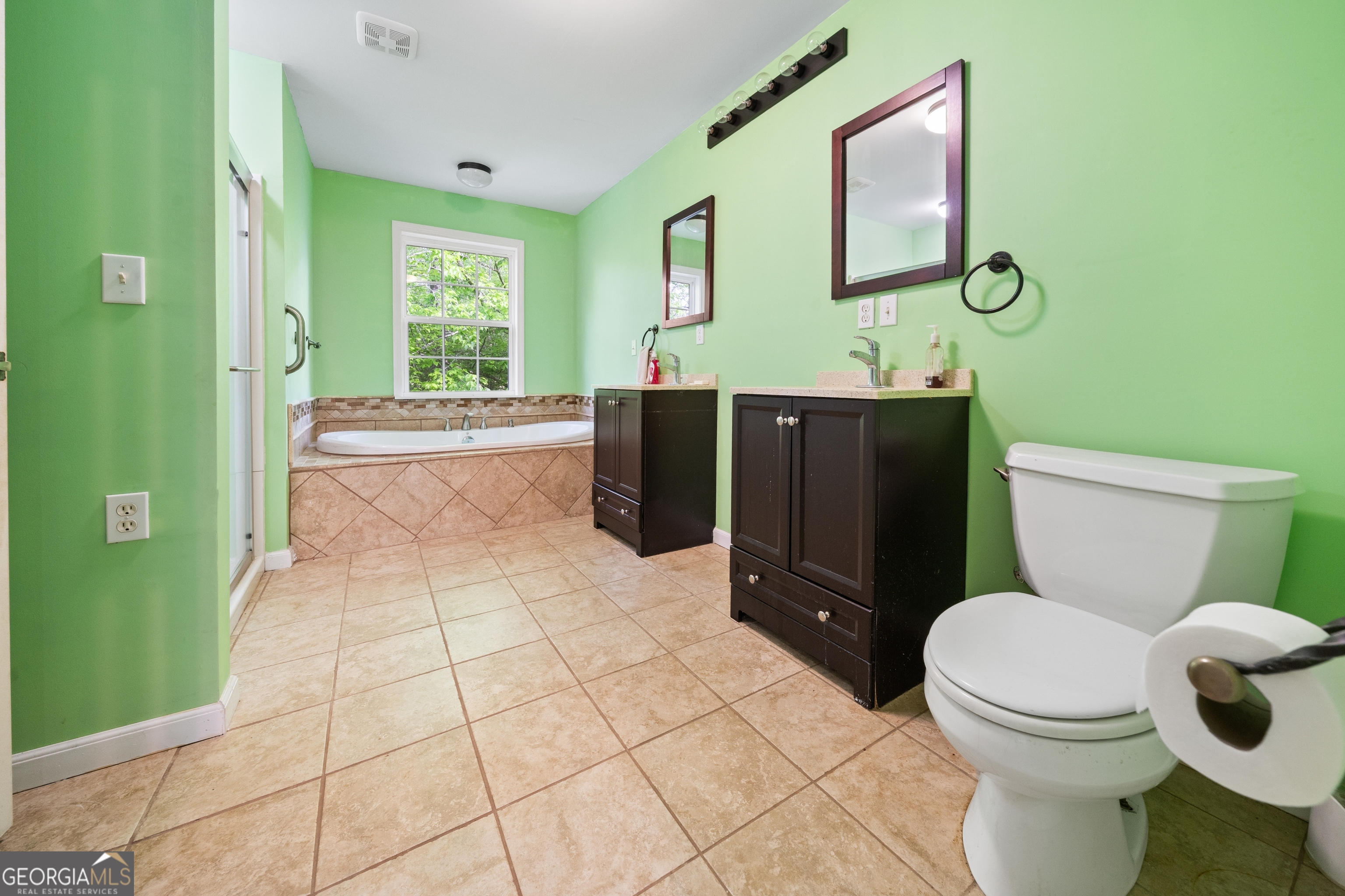3719 County Road 88 Delta, AL 36258 - Photo 20 of 36 a bathroom with a toilet a sink and mirror