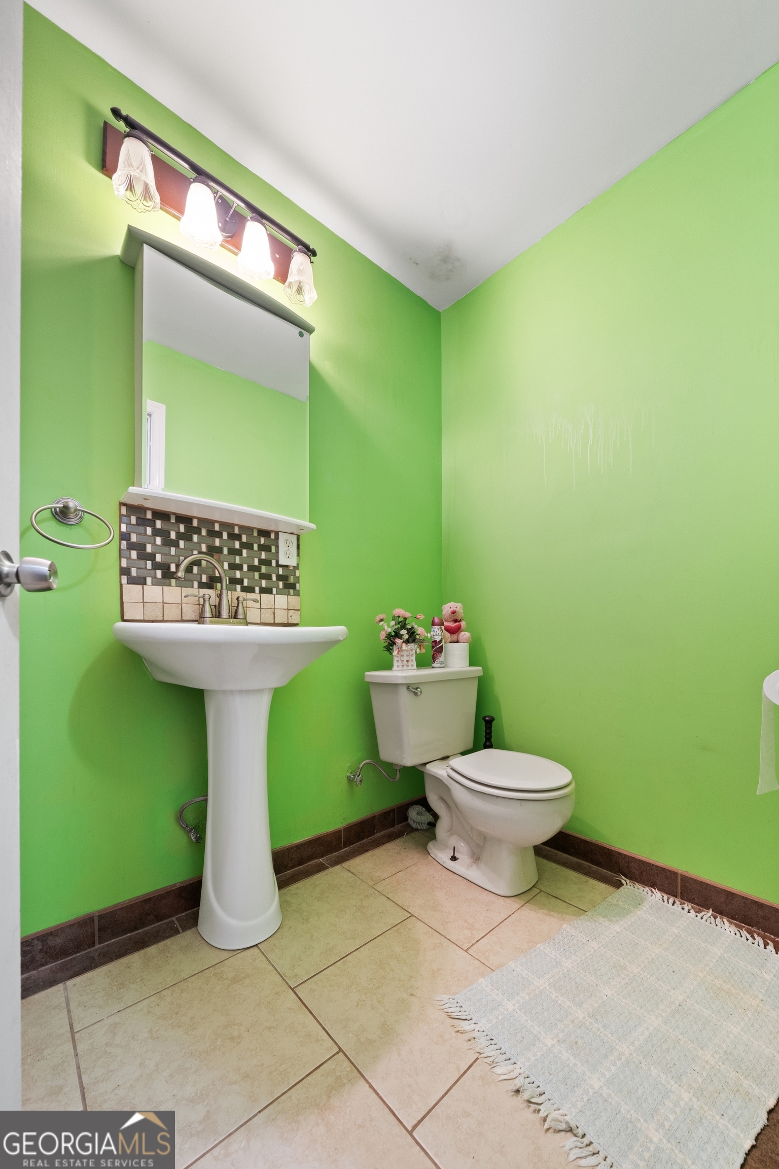 3719 County Road 88 Delta, AL 36258 - Photo 25 of 36 a bathroom with a toilet sink and mirror